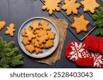 Gingerbread cookies and fir tree branch. Christmas holiday card