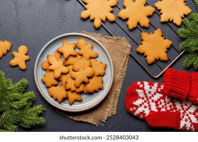 Gingerbread cookies and fir tree branch. Christmas holiday card - Powered by Shutterstock