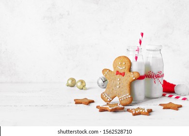 Gingerbread cookies and milk for Santa. Christmas composition with Gingerbread cookies and milk on white background, copy space. - Powered by Shutterstock