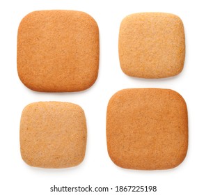 Gingerbread cookies in shape of squares in various size isolated on white background. Top view