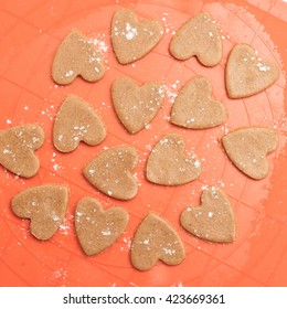 Gingerbread Heart Shaped Cookies Background. Raw Dough Prepared For Cookies. View From Above