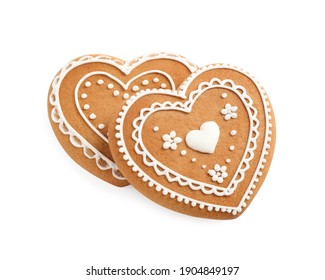 Gingerbread hearts decorated with icing on white background, above view