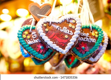 Gingerbread Hearts at German Christmas Market. Nuremberg, Munich, Fulda, Berlin, Hamburg xmas market in Germany. In German language Merry Christmas.