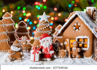 Gingerbread house christmas fir trees Santa Claus and gift cookies winter holiday celebration concept - Powered by Shutterstock