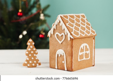 Gingerbread House And Gingerbread Tree On A Light Blue Background, Copy Space. Homemade Sweetness For Xmas, New Year 2022, Banner For Site, Flyer, Invitation