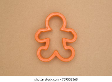 Gingerbread Man Cookie Cutter On A Kraft Background