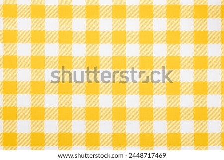 Gingham pattern in yellow and white, closed up texture of yellow and white for background. Picnic tablecloth.