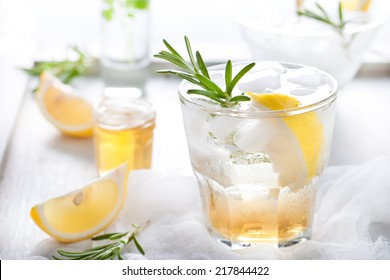 Gin,lemon, Rosemary Fizz, Cocktail With Honey And Fresh Herbs On A White Background.