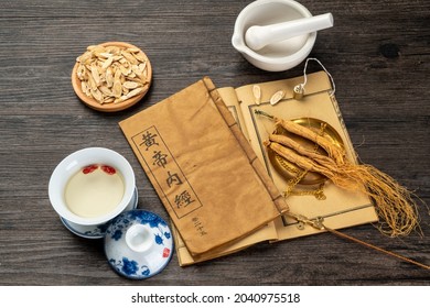 Ginseng and traditional Chinese medicine on the table.chinese translation：Emperor's Internal Classic