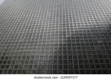 Ginza, Tokyo, Japan - April 19 2022: The exterior block glass wall of the HERMES building in Ginza. Designed by Renzo Piano.