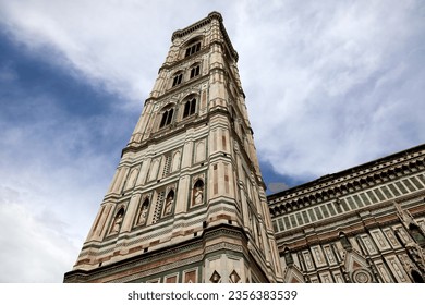 Giotto's Campanile, majestic free-standing bell tower is part of the building complex of the Cathedral of Santa Maria Del Fiore and is the undisputed masterpiece of Italian Gothic. Florence, Italy.