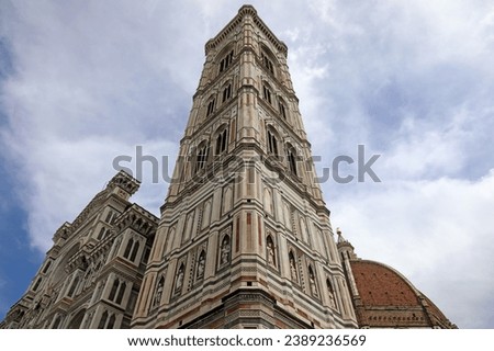 Giotto's Campanile, the majestic freestanding bell tower that forms part of the Cathedral of Santa Maria Del Fiore, is the undisputed masterpiece of Italian Gothic. Florence, Italy.