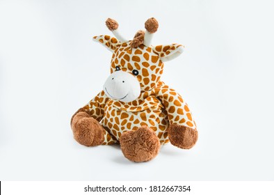 Giraffe Plush Toy Isolated On A White Background With Shadow Reflection. Colorful Children's Plush Toy. Colored Stuffed Giraffe Toy For A Child. White And Brown Giraffe