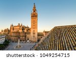 Giralda is the name given to the bell tower of the Cathedral of Santa Maria de la Sede of the city of Seville, in Andalusia, Spain. At its top is a ball called a jar on which stands the Giraldillo.