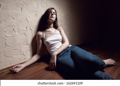 Girl Addict Unconscious Sitting On The Floor