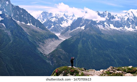 Girl admires a beautiful view of the mountains - Shutterstock ID 1670700613