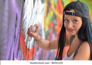 Girl Against Grafitti Wall