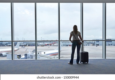 Girl At The Airport Window