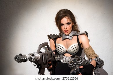 Girl - Amazon with a machine gun