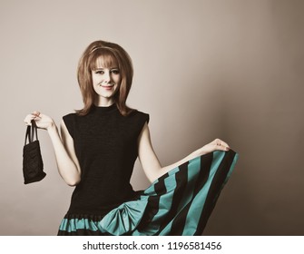 Girl In American 50s-60s Style With Handbag.