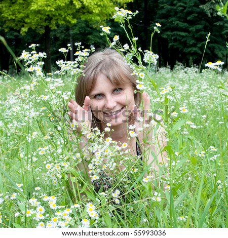 Similar – eine frau vor  einer blumenwiese. blumen pflücken