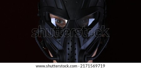girl in an apocalypse mask on a black background