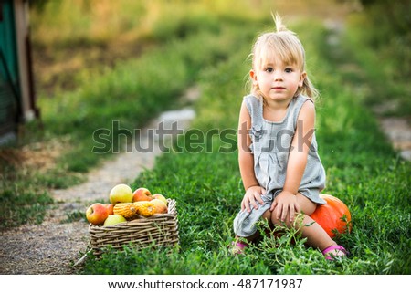 Similar – Image, Stock Photo Little girl looking apples in basket with harvest