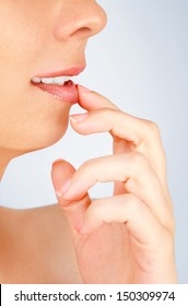 Girl Applying Lip Balm With Finger