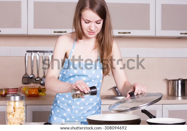 Woman cooking who are naked