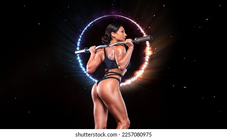 Girl athlete, bodybuilder. Back view. Download a photo to design an advertisement for a gym or a sports club