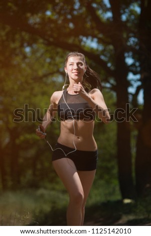 Similar – Happy fit woman taking a break from jogging