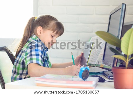 Similar – Image, Stock Photo happy school girl doing homework. Smart child working hard