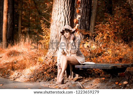 Similar – Woman with a bike in the middle of the forest.