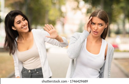 Girl Avoiding Meeting Toxic Friend Girl Ignoring Her Greeting Walking In Park Outdoors. Selective Focus