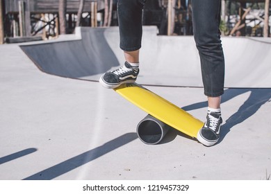  Girl Balances On A Yellow Balance Board