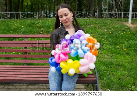 The girl with the balloons. Balloon flowers