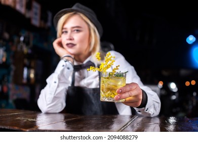 Girl Bartender Concocts A Cocktail At The Beerhouse