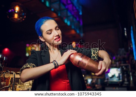 girl bartender makes a cocktail