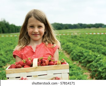 Girl with basket strawberry - Powered by Shutterstock