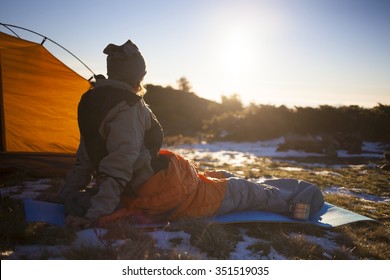 The Girl Basking In A Sleeping Bag At Dawn.
