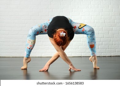 Girl in beautiful yoga position indoors on white background - Shutterstock ID 1656138583