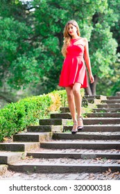 Girl Before The Debutante Ball Down Stairs With Red Dress