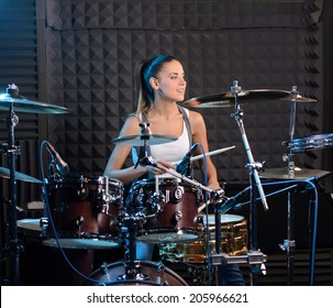 Girl Behind Drum-type Installation In A Professional Recording Studio