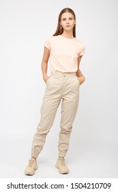 Girl In Beige Cargo Pants And A T-shirt