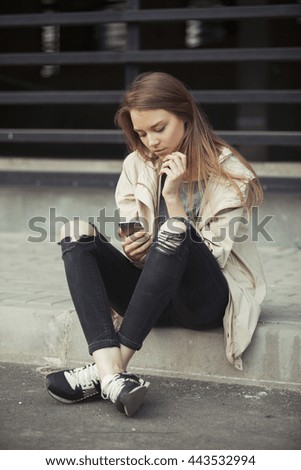 Similar – Image, Stock Photo Blonde woman looking at her smartphone outdoors