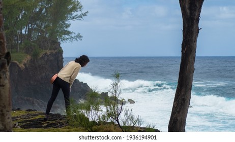 Girl Bending Over A Cliff, Indian Ocean