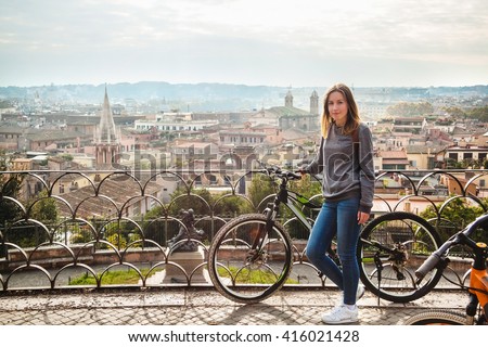 Girl with a bicycle in Rome, Italy