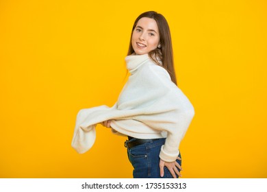 Girl In Too Big Sweater After Losing Weight. The Concept Of Healthy Eating