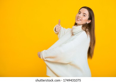 Girl In Too Big Sweater After Losing Weight. The Concept Of Healthy Eating