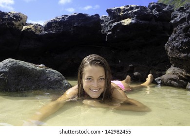 Girl In Bikini In A Tide Pool In Hawaii